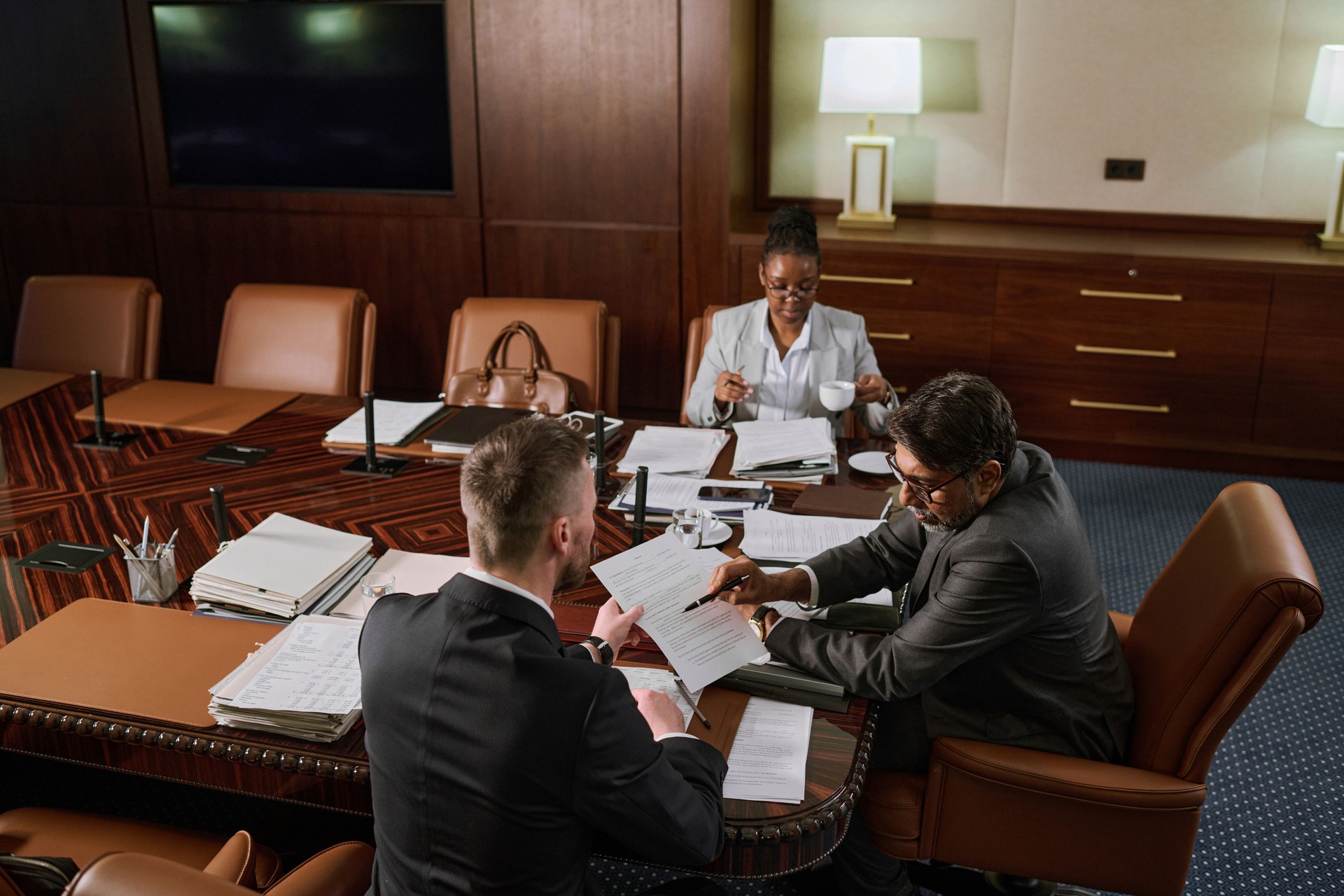 Two male colleagues discussing contract